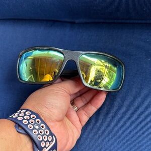 Stylish Black Sunglasses with Gold Lenses